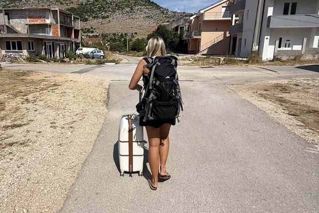 Friends Make Major Mistake While Booking Their Airbnb, Then Have to Walk Across Bosnian Border with Suitcases (Exclusive) - Featured Image