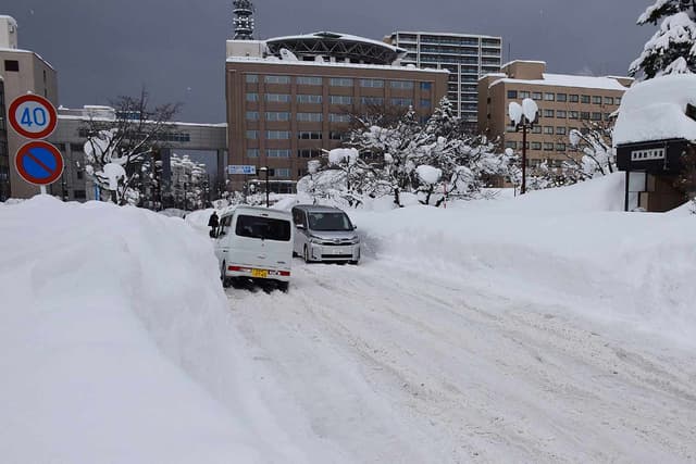 At Least 35 Dead and Almost 400 Injured as 6.5 Feet of Snow Hits Japan, with Authorities Warning of Impending Avalanches - Featured Image