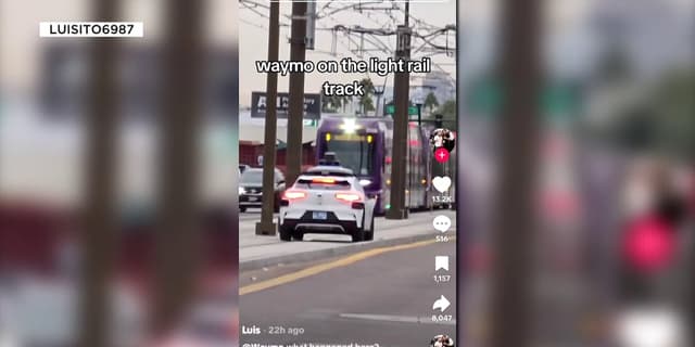 Waymo passenger jumps out of self-driving car after it stops on rail tracks near oncoming train - Featured Image