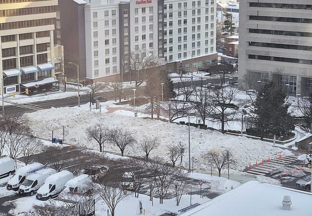 Huge pile of ‘snowcrete’ fills street in Courthouse as cleanup efforts continue | ARLnow.com - Featured Image