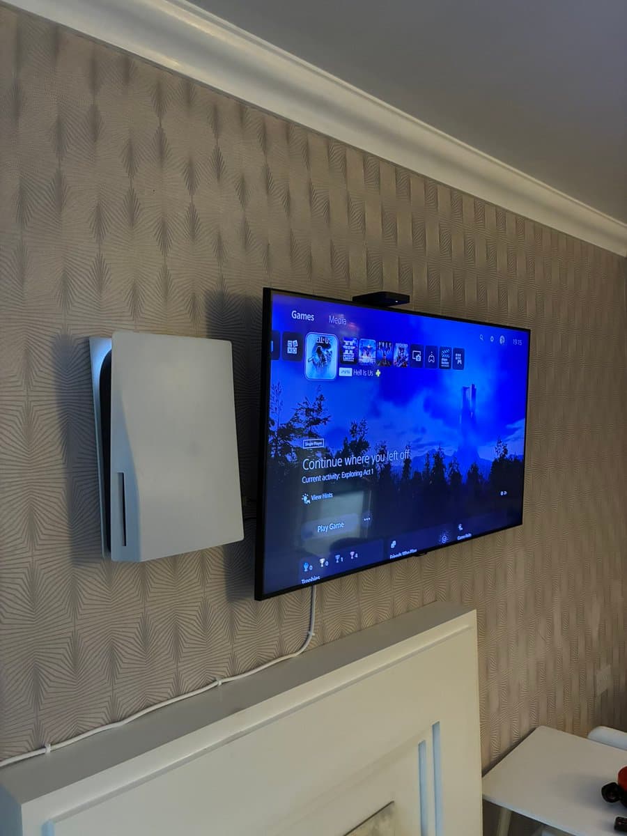 Jimmy Bowers Mounts TV and PS5 on Wall in DIY Win