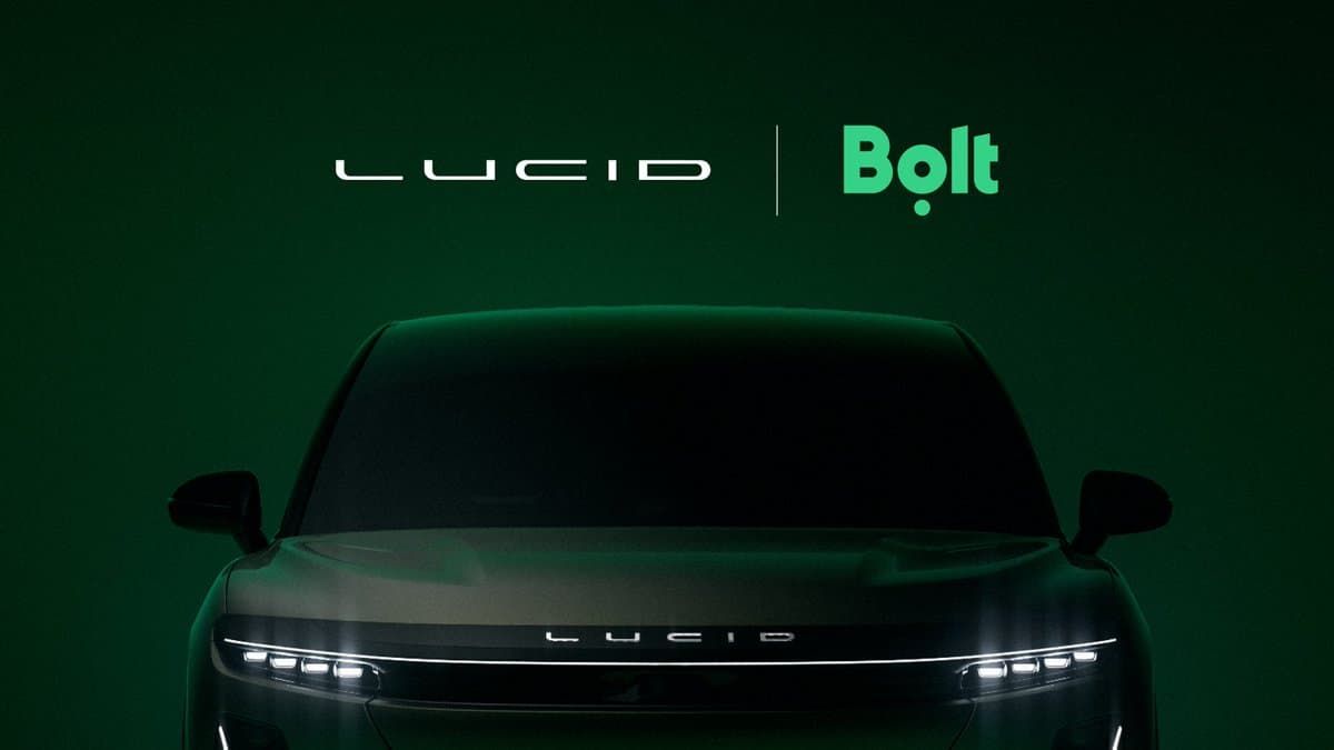 Lucid and Bolt logos appear above the front of a Lucid vehicle on a dark green background.