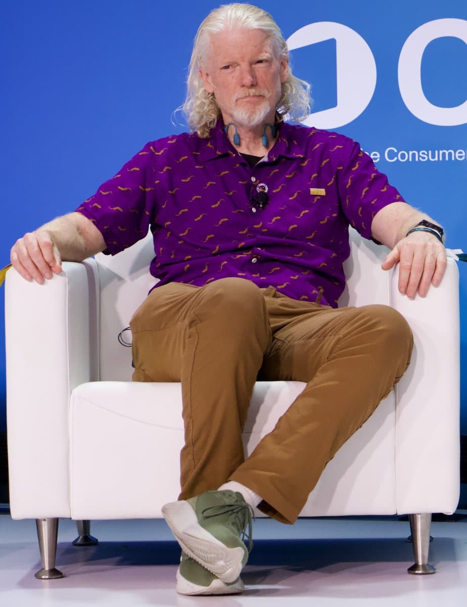 Twitch CEO Dan Clancy sits onstage during an industry event.