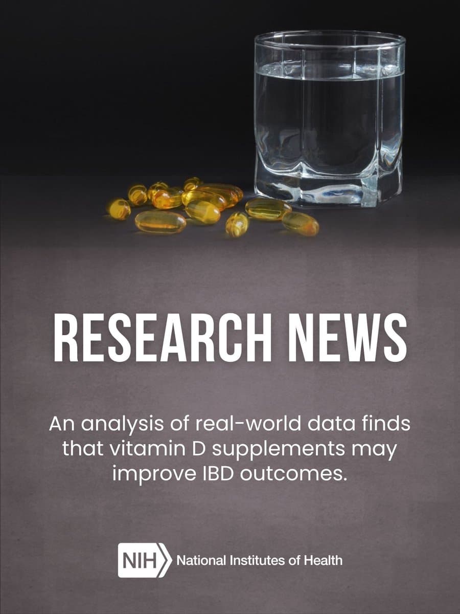 Glass of water and vitamin D capsules on a table, with text stating, "RESEARCH NEWS: An analysis of real-world data finds that vitamin D supplements may improve IBD outcomes." NIH logo is present.