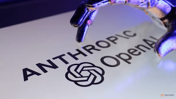 Robotic hand above the Anthropic and OpenAI logos in a Reuters illustration.