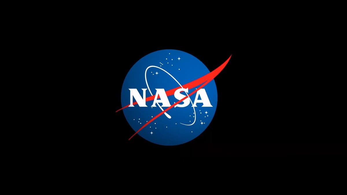A graphic depicting the NASA "meatball" insignia, a blue sphere with white stars and a red swoop, against a black background.